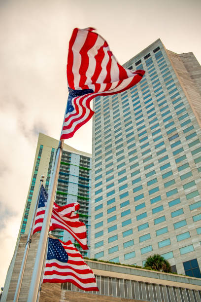 istock American flags against tall skyscrapers 2153080405