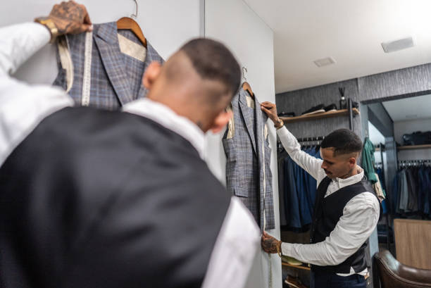 istock Tailor measuring a suit at the store 2153081087