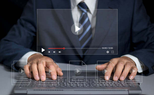 istock Man using pressing the play button to start online entertainment for an online video-on-demand streaming service over the internet that includes movies or music. 2153081655