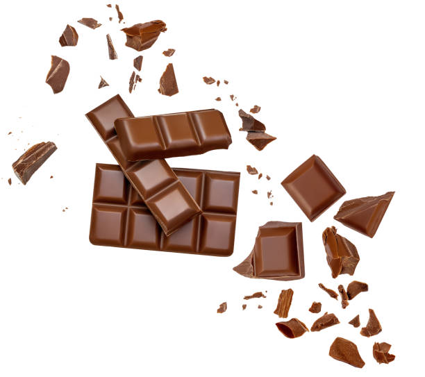 istock Levitating milk chocolate chunks isolated on white background. Dark Chocolate piece explosion, shavings and cocoa crumbs Top view. Flat lay 2153087073