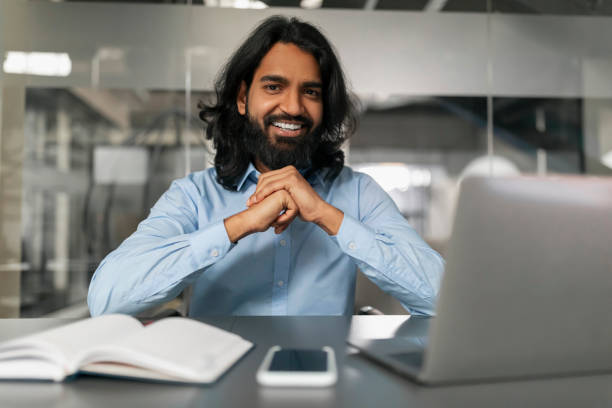 istock Happy man in office posing for photo 2153094012