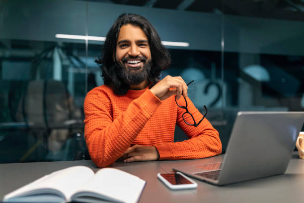 istock Happy indian businessman posing at modern office 2153094078