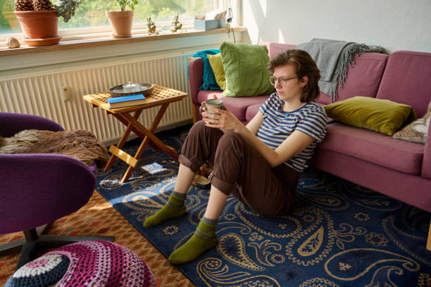 istock Sitting relaxed on the floor leaning against a chair 2153094305