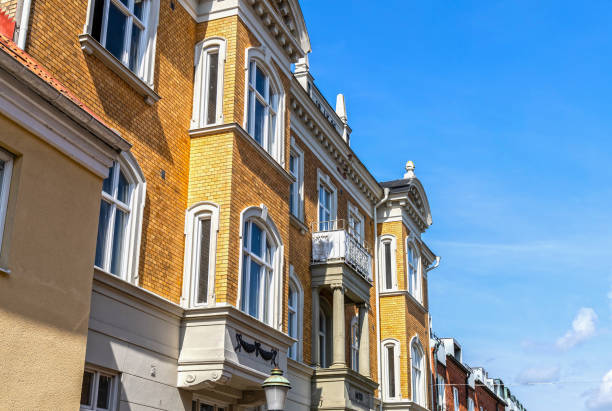 istock Residential building in ancient style on a sunny day against a blue sky. 2153094671