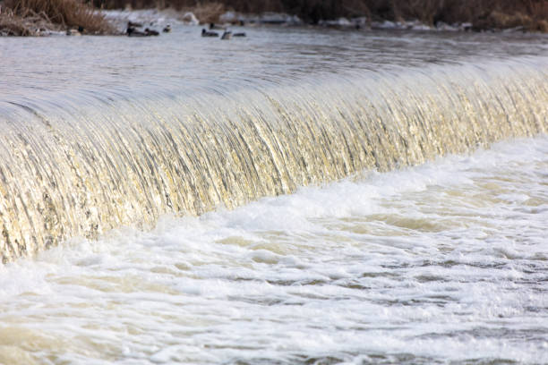 Waterfall on the river in winter as a background.