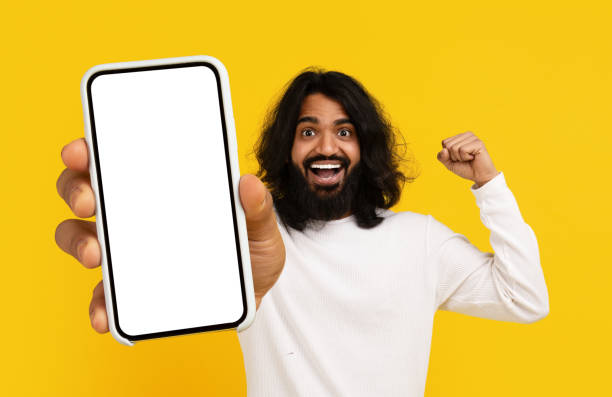 istock Man With Long Hair Holding Cell Phone 2153096771
