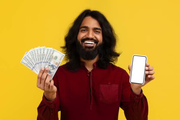 istock Excited young indian guy holding smartphone with white blank screen 2153096884