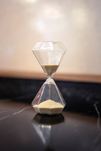 istock A sandglass or hourglass on table. 2153097098