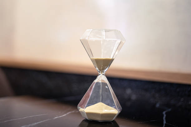 istock A sandglass or hourglass on table. 2153097107
