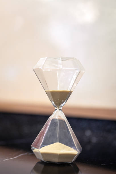 istock A sandglass or hourglass on table. 2153097109