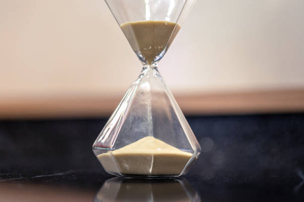 istock A sandglass or hourglass on table. 2153097114
