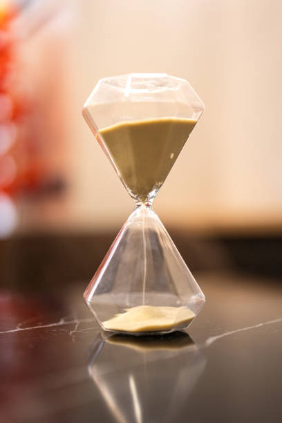 istock A sandglass or hourglass on table. 2153097186