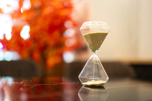 istock A sandglass or hourglass on table. 2153097201
