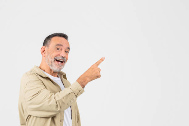 istock Senior man pointing happily to the side 2153098996