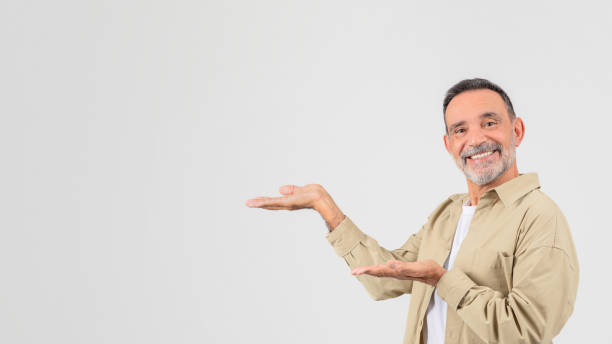 istock Senior showcasing with hand gesture Sick senior man coughing on white background 2153099042