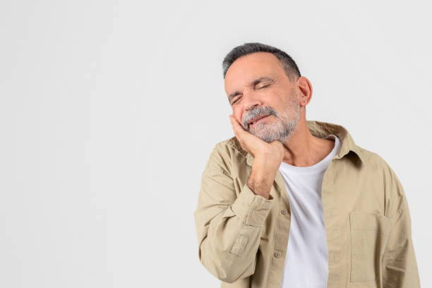 istock Mature man with toothache grimacing in pain 2153099092
