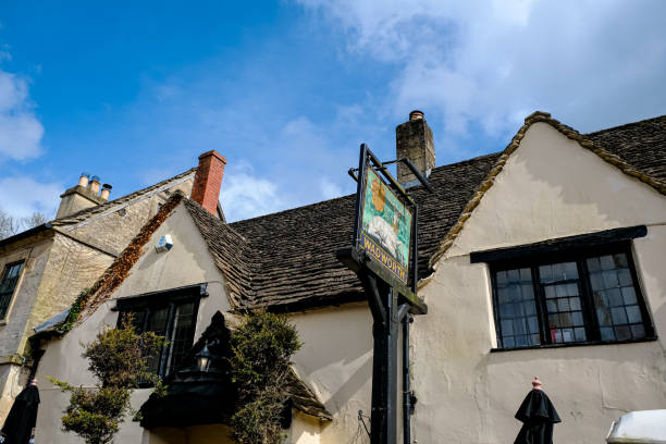 Castle Combe, Cotswolds, UK - 07.04.2024. View of The White Hart pub view in the village centre, Castle Combe, Wiltshire, England, UK.