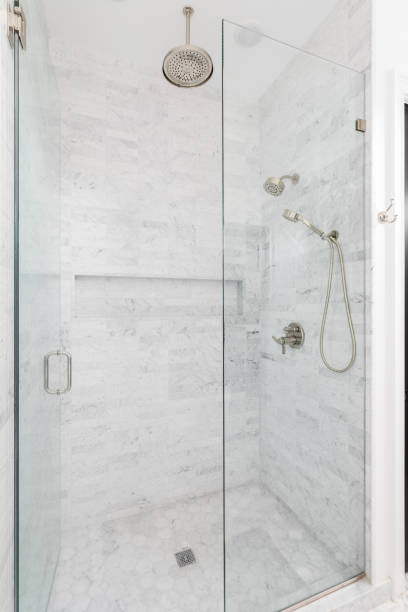 istock A walk-in shower with marble and hexagon tiles. 2153100243