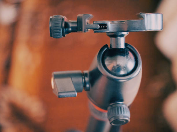 Tripod head for the camera, close-up. A tripod head is the part of a tripod system that attaches the supported device to the tripod legs.