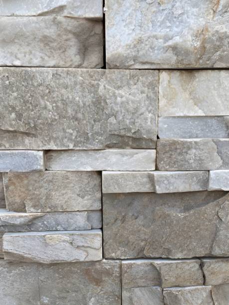 istock Background. Brick wall. Textured Stone Wall.  Uneven Protrusions 2153100888