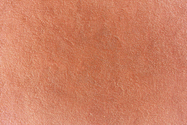 istock Close up of red painted plaster wall with rough surface 2153101654