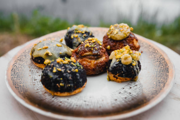 A plate displaying a diverse assortment of freshly baked pastries,