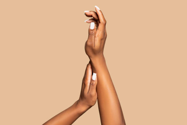 Delicate hand skin care, minimalist beige background