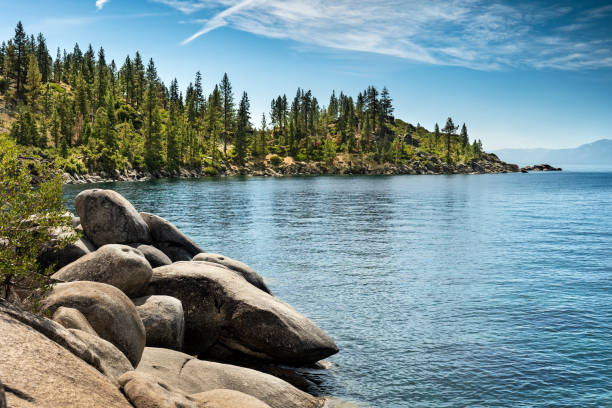 Scenic nature view over Lake Tahoe from the rocky boulders on shore in summer