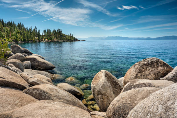 Scenic nature view over Lake Tahoe from the rocky boulders on shore in summer