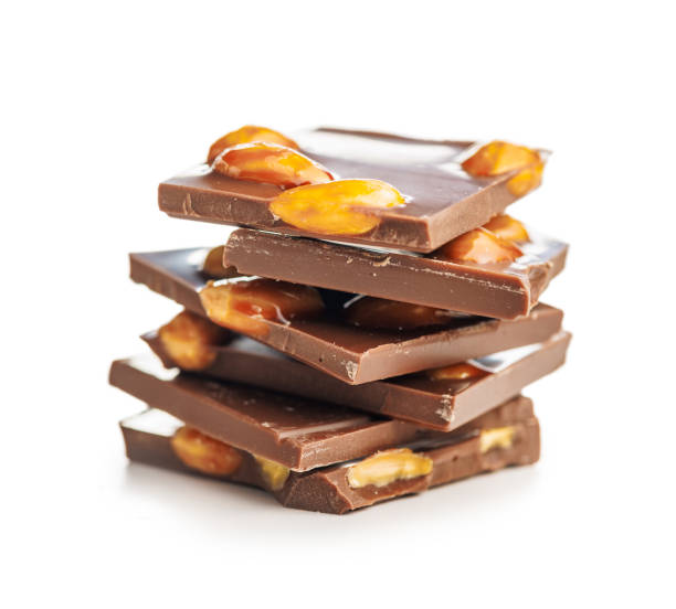 istock Broken chocolate bar with almonds isolated on white background. 2153114225