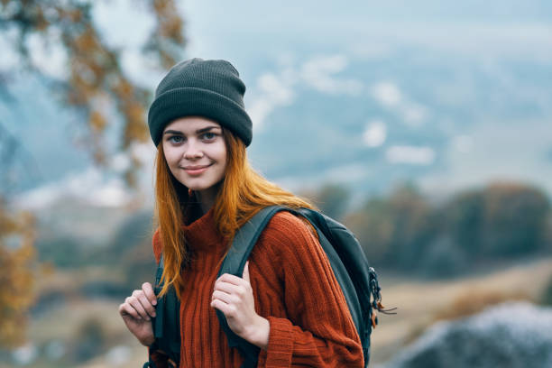istock woman hiker with backpack nature vacation walk adventure 2153114766