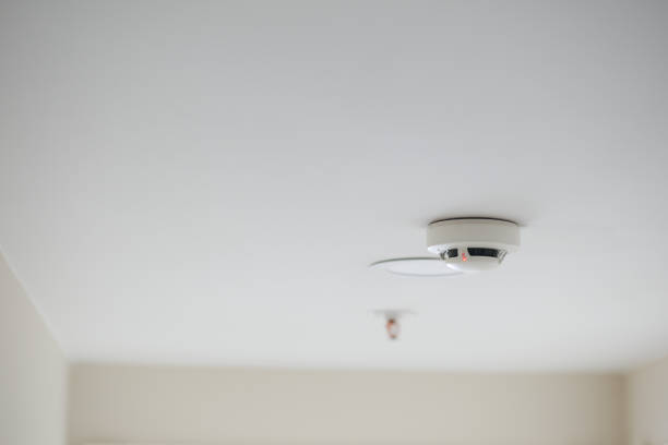 istock White smoke detector on ceiling at home 2153117458