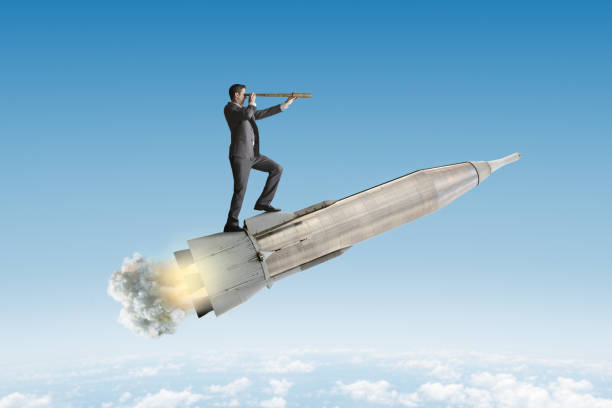 istock Man Riding Rocket Ship Looks Through Spyglass 2153119014