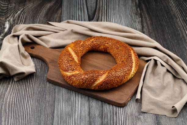 istock Turkish traditional bagel / simit with sesame on rustic table, turkish breakfast pastry concept 2153125057