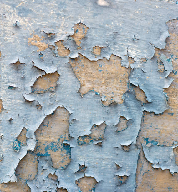 istock Old weathered concrete wall with peeling paint with blue colors on each layer textured background 2153127813