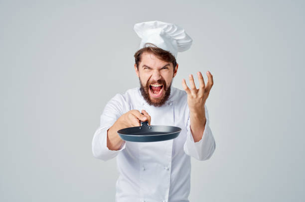 istock earded man chef kitchen utensils Job light background 2153131972