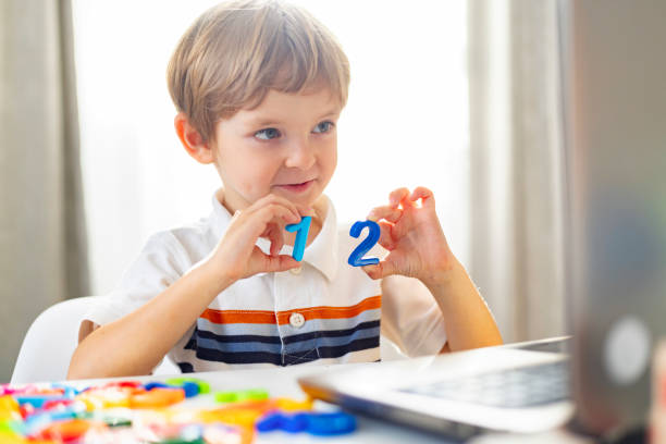 istock Young Boy Learning Numbers at Home, Engaged in Early Childhood Education 2153132806