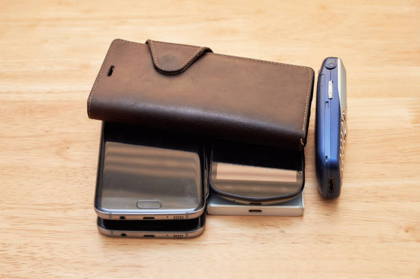 istock several old used up cell phones from different decades piled up on the table 2153134659
