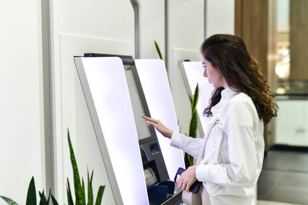 istock Female Entering Her Bank Account Credentials On ATM 2153136085