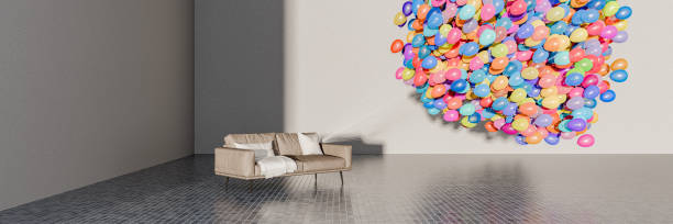 istock Sofa with tied group of balloons 2153136258