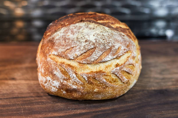 appetizing home made loaf of bread cooling on the countertop