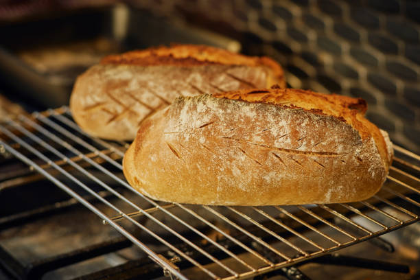 istock Freshly baked organic rye bread cooling on the tray 2153136460