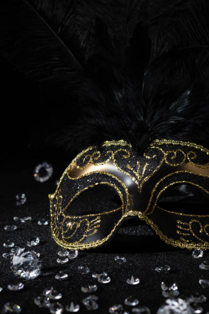 istock Masquerade gold mask with gemstones on black background. 2153142510