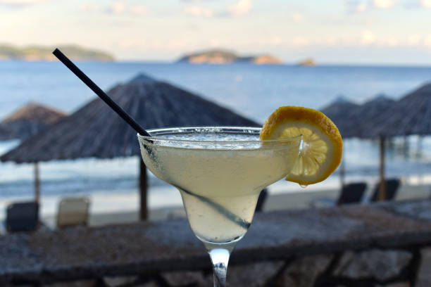 istock Refreshing citrus cocktail beside a beach in the evening 2153145466