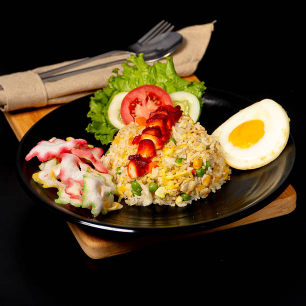 Yang Chow fried rice served with Cha Siew Chicken, sunny side up egg and crackers