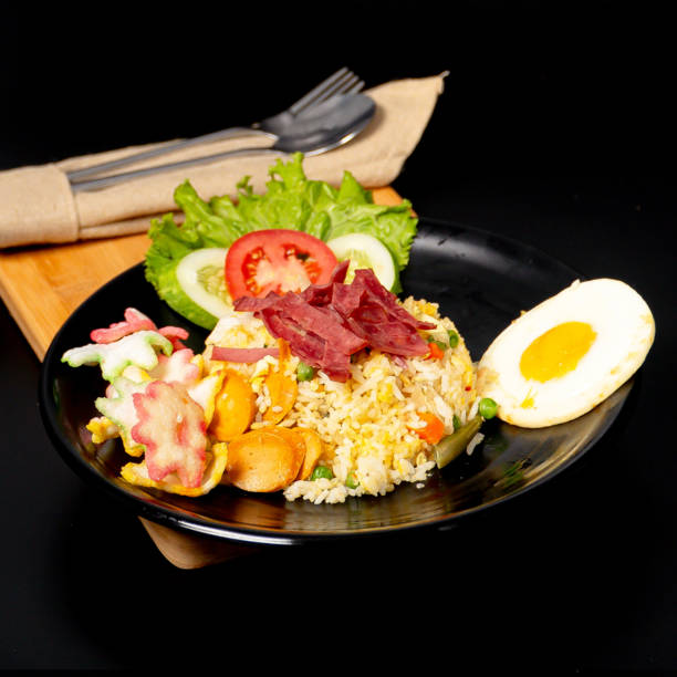 istock Smoke Beef Fried Rice served with smoke beef, sausage, sunny side up egg and crackers 2153147089