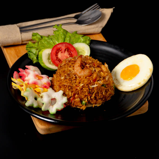 istock Seafood fried rice served with shrimp, squid, sunny side up egg and crackers 2153147091
