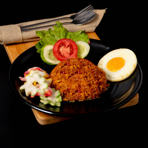 istock Fried rice with shrimp paste served with shredded chicken, sunny side up egg and crackers 2153147092