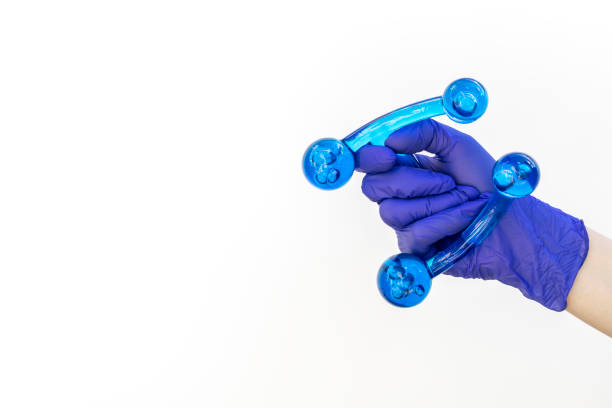 istock Mockup Human Gloved Hand Holds Blue Acrylic Back, Leg, Neck Massage Tool. Deep Tissue Massage, Thumb Massager with Knobs for Gentle Point, Muscles Relaxation. Design, Copy Space.Horizontal 2153148558