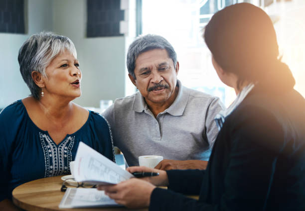 istock old couple, discussion and financial advisor with documents for retirement, budget advice and will at home. Old man, elderly woman and attorney with paperwork, negotiation and legal agreement 2153154041